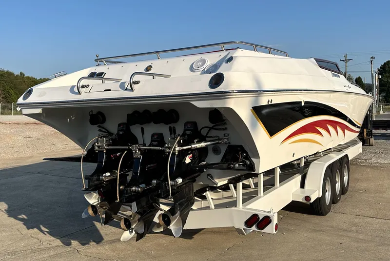 Slide: The Image of 2007 Fountain 47 Lightning speedboat on trailer, rear view, showcasing powerful engines and sleek design. - 18