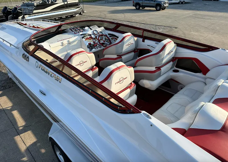 Slide: The Image of 2007 Fountain 47 Lightning boat with white and red interior, docked on a sunny day. - 22