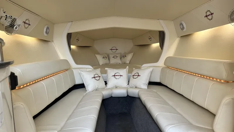 Slide: The Image of Luxurious interior of a 2007 Fountain 47 Lightning boat with plush white seating and branded cushions. - 27