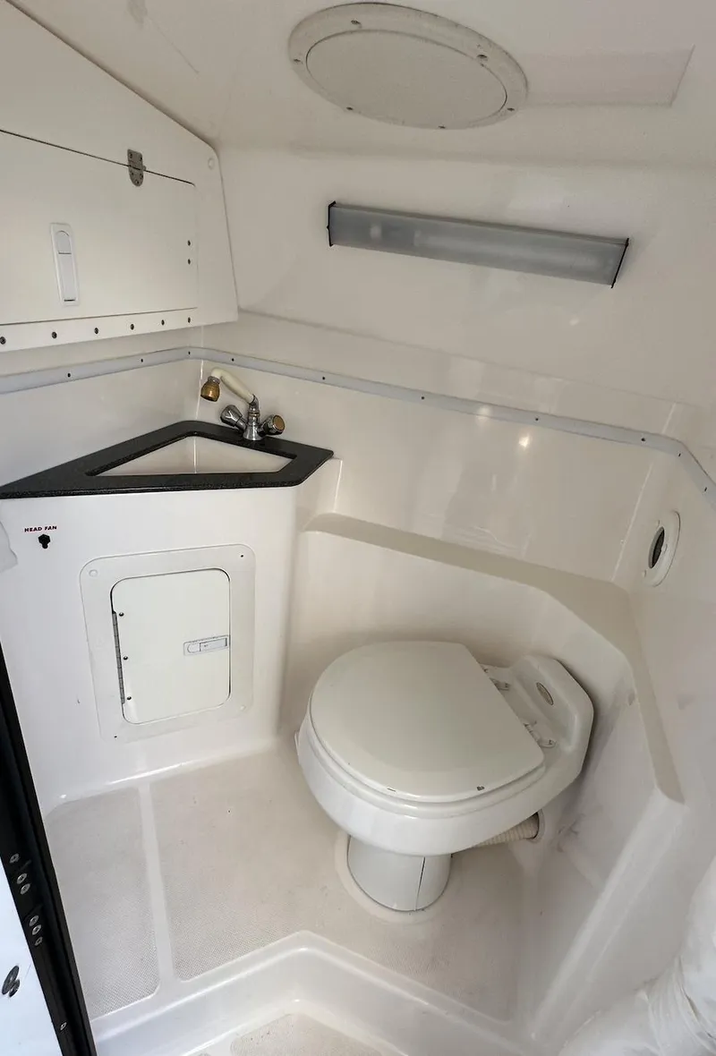 Slide: The Image of 2007 Fountain 47 Lightning boat bathroom with toilet and sink. - 29