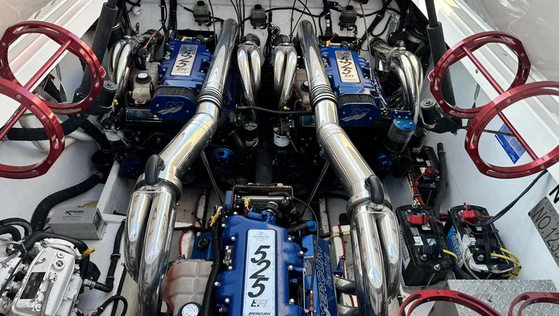 Slide: The Image of Engine compartment of a 2007 Fountain 47 Lightning boat with powerful engines and chrome exhausts. - 31