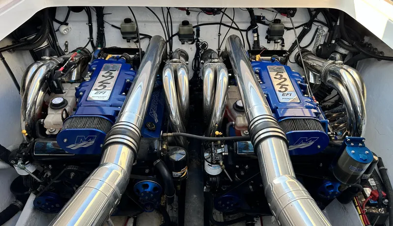 Slide: The Image of Twin engines of a 2007 Fountain 47 Lightning boat, showcasing powerful performance components. - 32