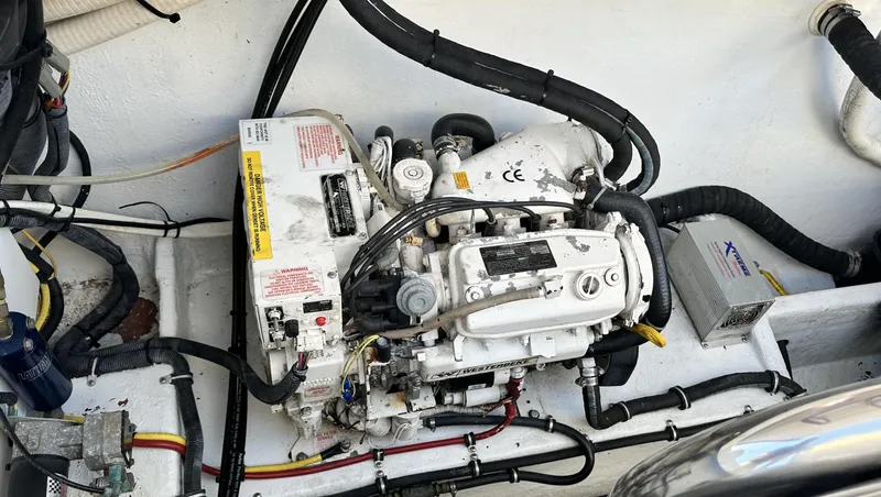 Slide: The Image of Engine compartment of a 2007 Fountain 47 Lightning boat, showcasing mechanical components. - 33