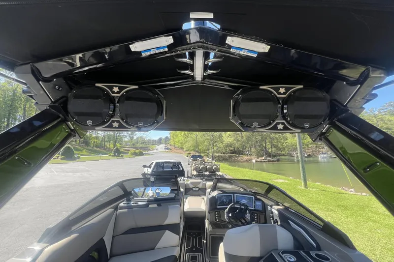 Slide: The Image of Interior view of 2023 Centurion Ri265 boat with speakers and control console. - 21
