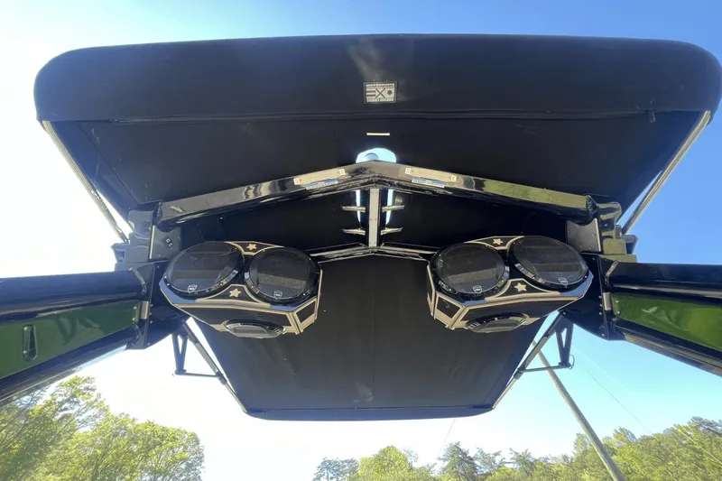 Slide: The Image of 2023 Centurion Ri265 boat with speakers under the canopy. - 22