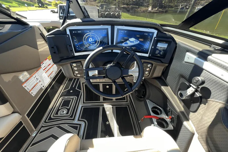Slide: The Image of Interior view of 2023 Centurion Ri265 boat cockpit with modern displays. - 23