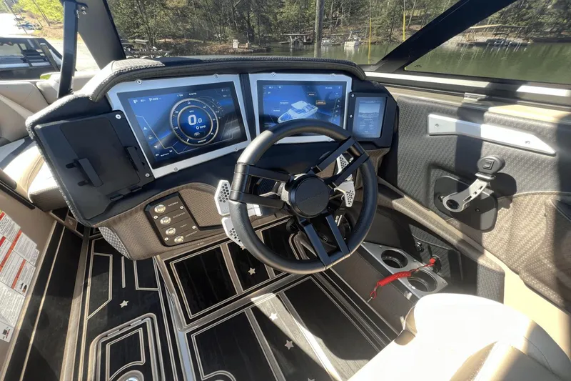 Slide: The Image of 2023 Centurion Ri265 boat cockpit with modern controls and touchscreen displays. - 24