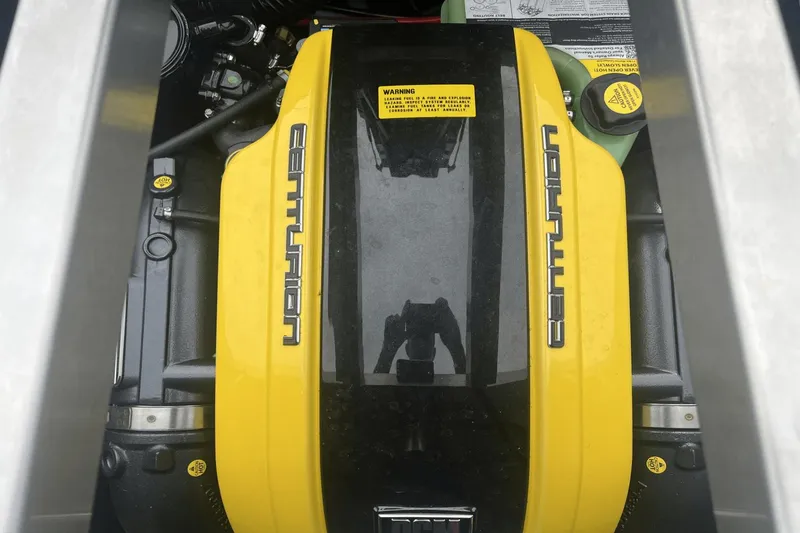 Slide: The Image of 2023 Centurion Ri265 engine with yellow cover. - 31