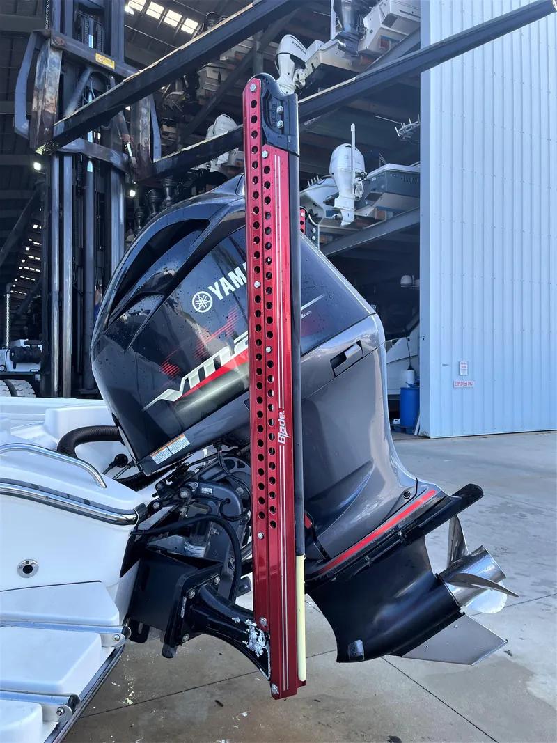 Slide: The Image of 2017 Pathfinder 2300 HPS with Yamaha outboard motor in a boatyard. - 14