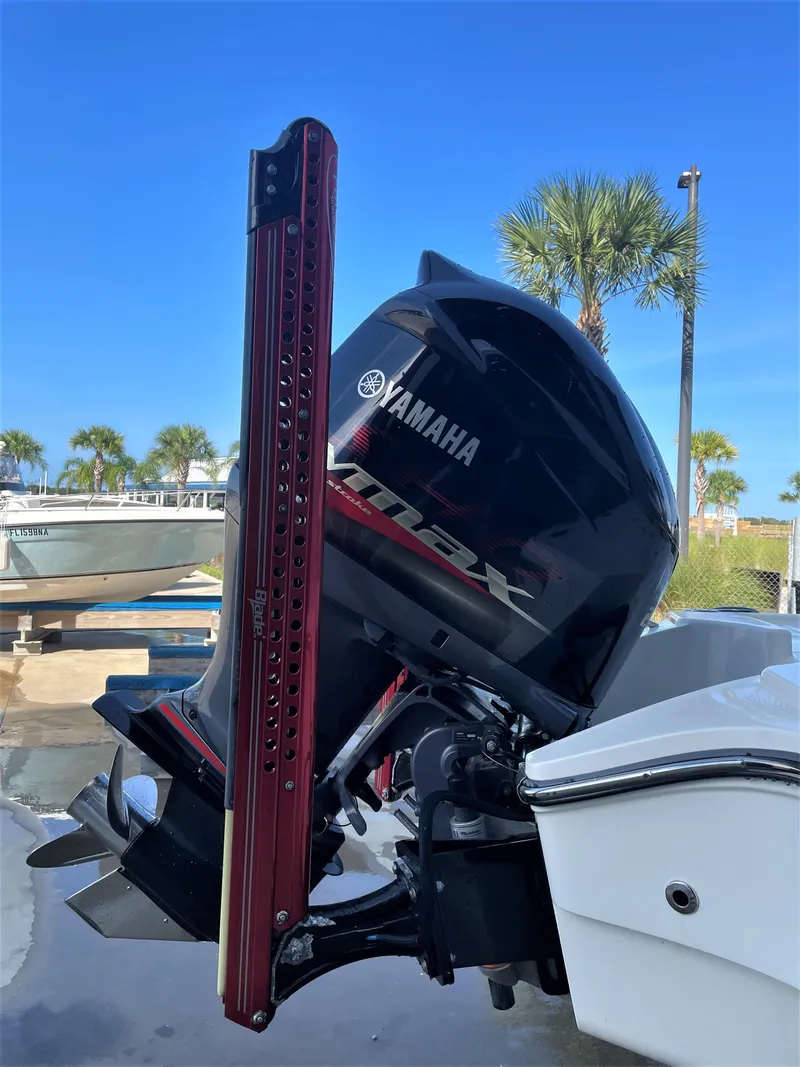 Slide: The Image of 2017 Pathfinder 2300 HPS with Yamaha outboard motor in a marina. - 15
