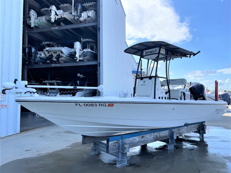 Slide: The Image of 2017 Pathfinder 2300 HPS boat on a lift in a marina storage facility. - 3