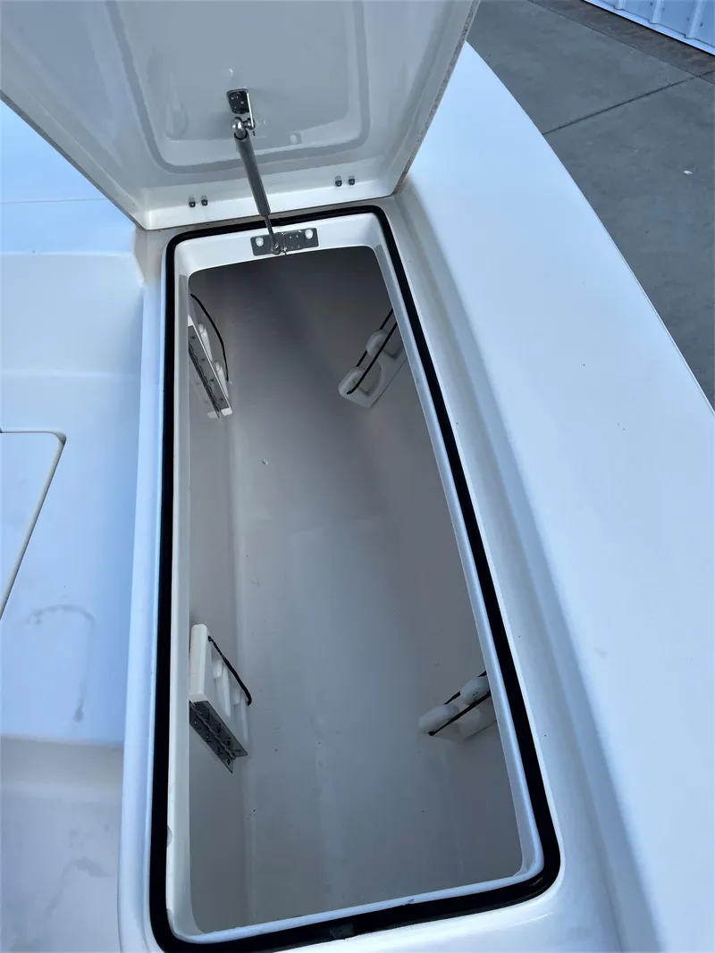Slide: The Image of Open storage compartment on a 2017 Pathfinder 2300 HPS boat. - 30