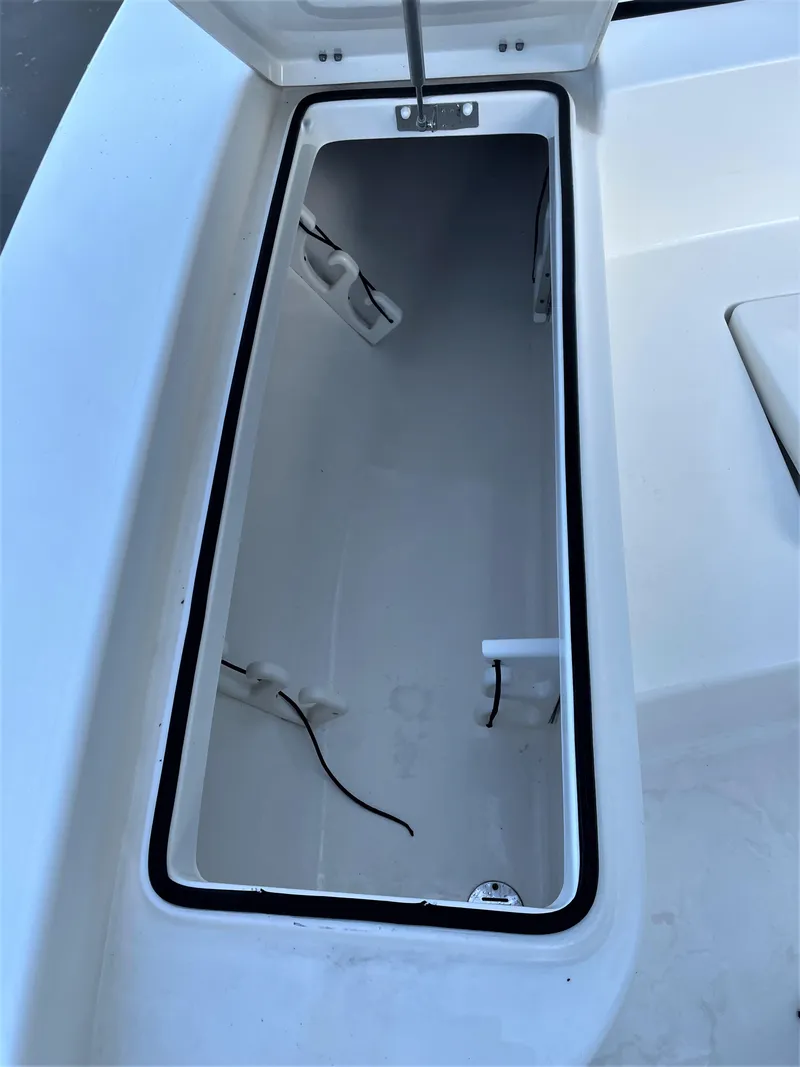 Slide: The Image of 2017 Pathfinder 2300 HPS boat storage compartment with open lid. - 31