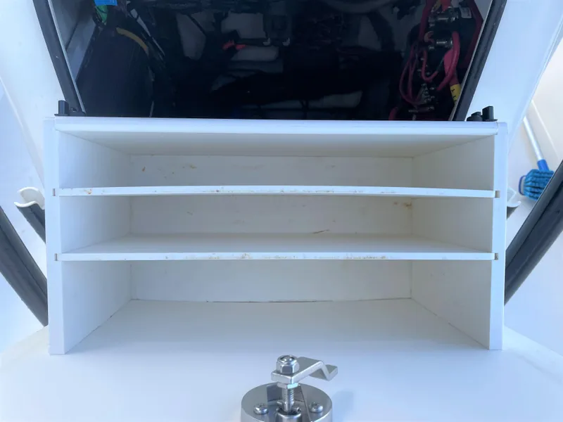 Slide: The Image of 2017 Pathfinder 2300 HPS boat storage compartment with shelves. - 33