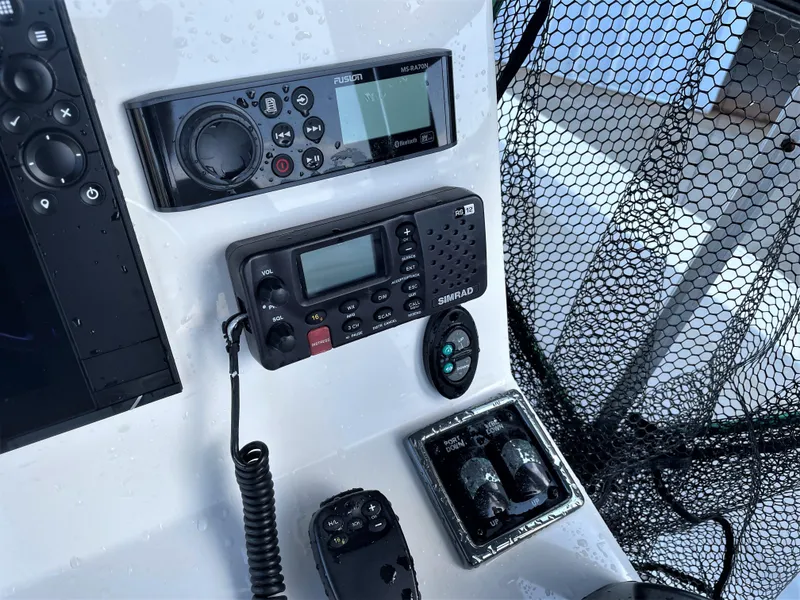 Slide: The Image of 2017 Pathfinder 2300 HPS boat dashboard with navigation and communication equipment. - 38