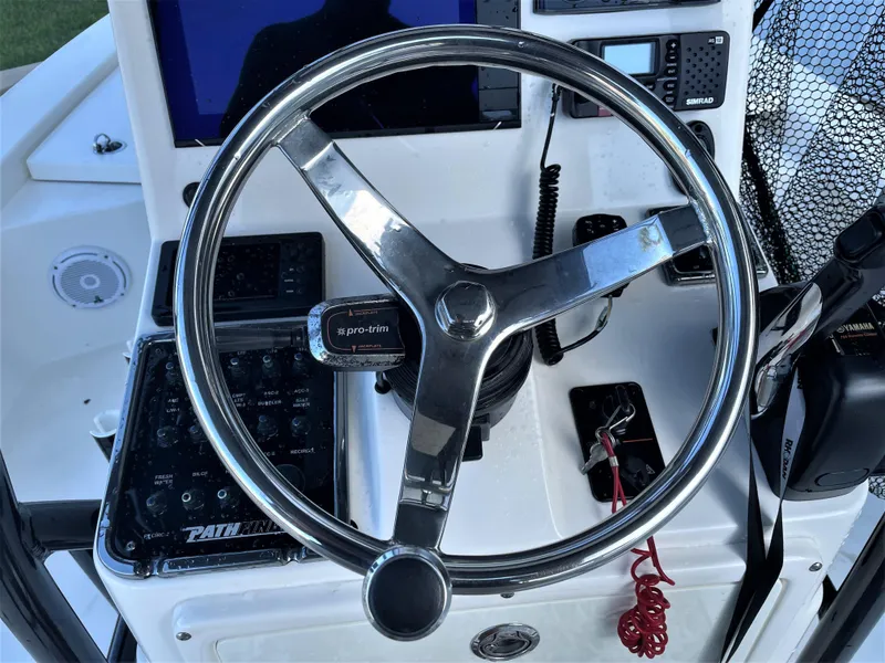 Slide: The Image of 2017 Pathfinder 2300 HPS boat steering wheel and control panel. - 42