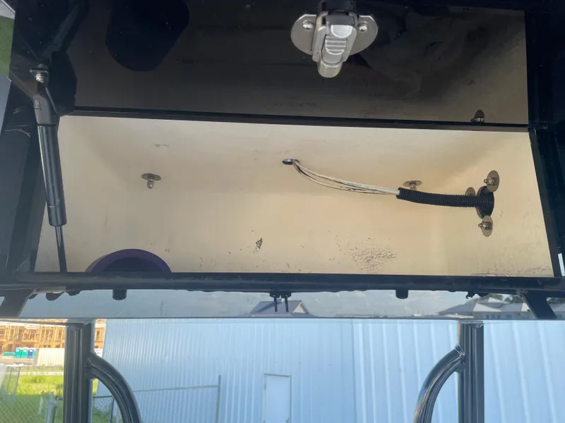 Slide: The Image of Open storage compartment of a 2017 Pathfinder 2300 HPS boat. - 45