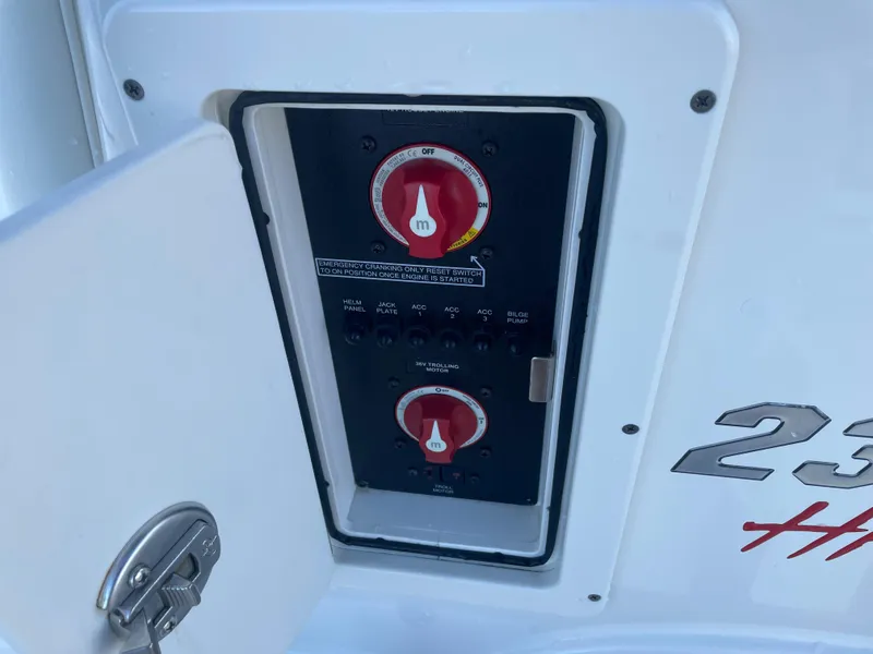 Slide: The Image of 2017 Pathfinder 2300 HPS boat control panel with open access door. - 47