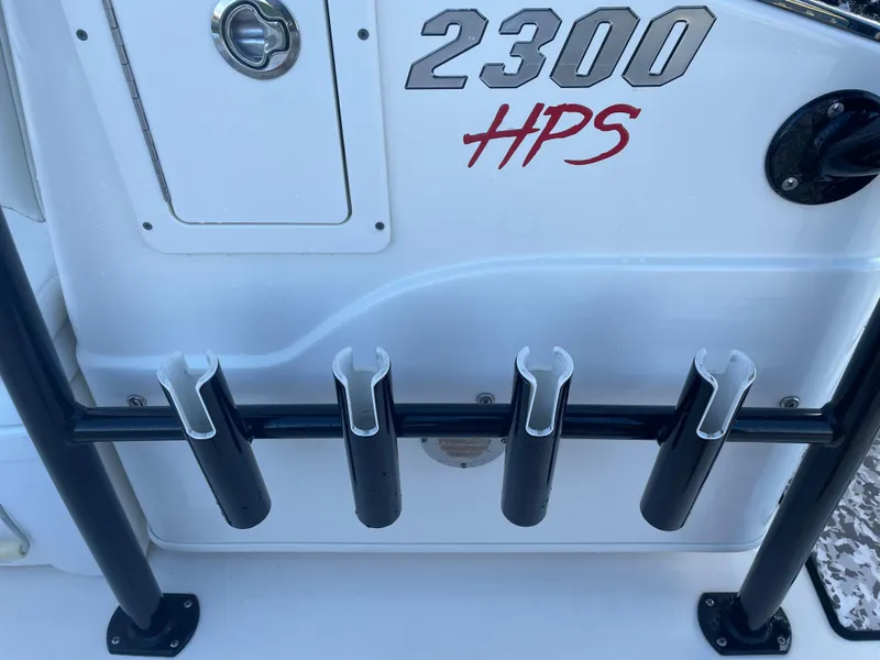 Slide: The Image of 2017 Pathfinder 2300 HPS boat with rod holders and storage compartment. - 49