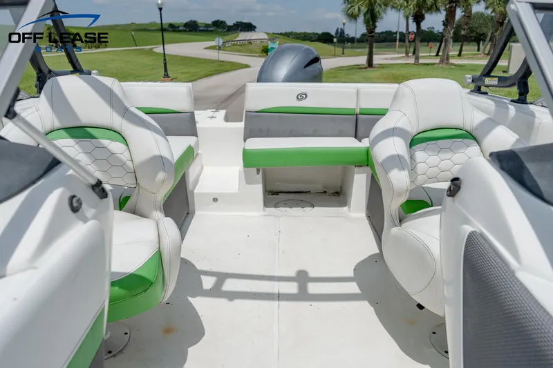 Slide: The Image of 2020 Hurricane 217 SD boat interior with white and green seating. - 10