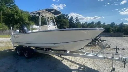The Image of 2024 Mako 214 CC boat on trailer under clear sky. - 0