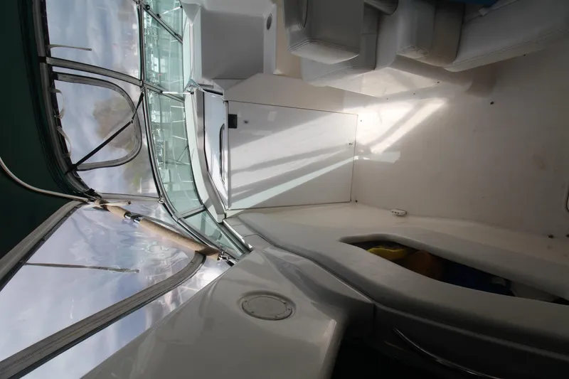 Slide: The Image of 1998 Wellcraft 3200 Martinique boat interior with seating and windshield. - 8