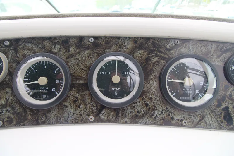Slide: The Image of Dashboard gauges of a 1998 Wellcraft 3200 Martinique boat. - 9