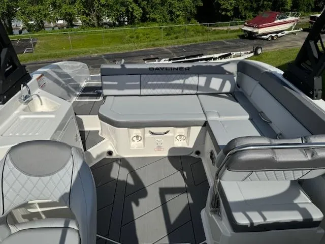 Slide: The Image of 2024 Bayliner DX 2250 boat interior with spacious seating and modern design. - 10