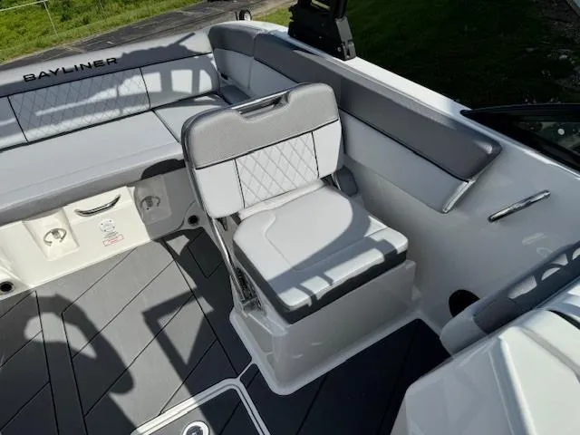 Slide: The Image of 2024 Bayliner DX 2250 boat interior with gray and white seating. - 11