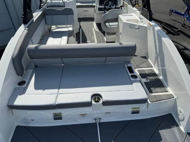 Slide: The Image of 2024 Bayliner DX 2250 boat interior with seating and storage compartments. - 3