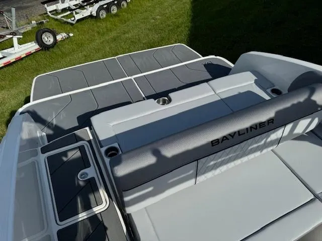 Slide: The Image of 2024 Bayliner DX 2250 boat rear deck and seating area. - 4