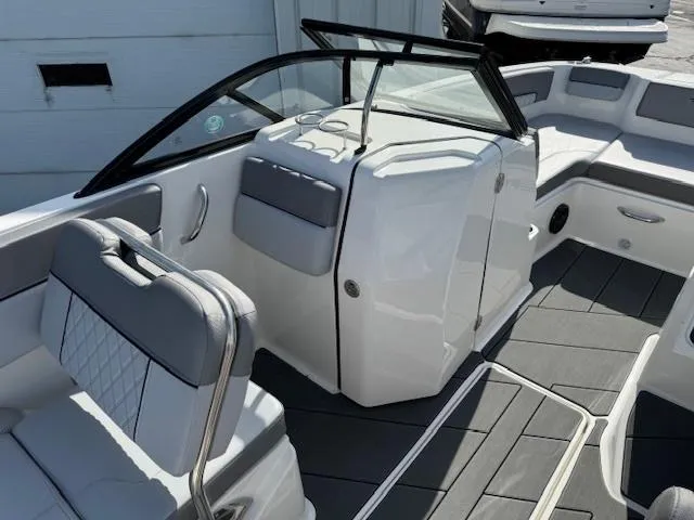 Slide: The Image of 2024 Bayliner DX 2250 boat interior with modern seating and sleek design. - 8