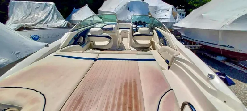 Slide: The Image of 2006 Monterey 234 FS boat with spacious seating and covered storage. - 11