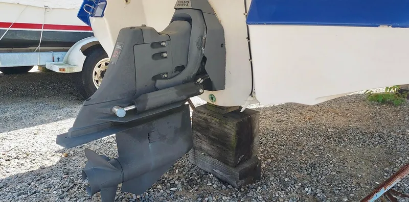 Slide: The Image of 2006 Monterey 234 FS boat outdrive on gravel. - 4