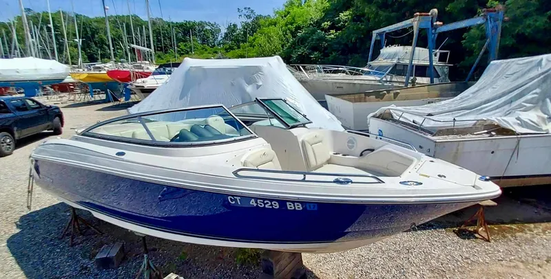 Slide: The Image of 2006 Monterey 234 FS boat in storage yard with other boats. - 5