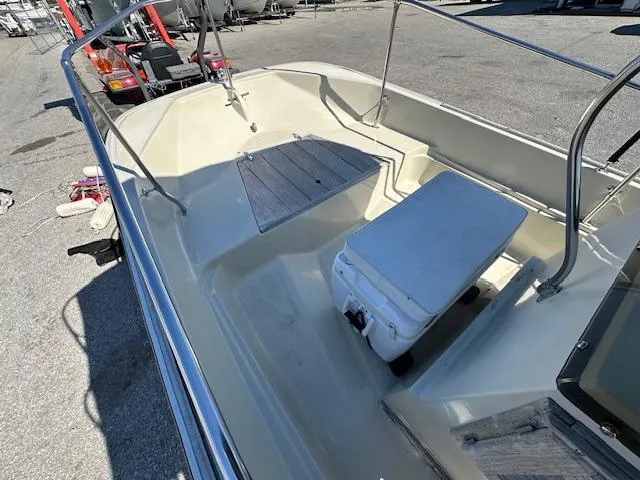 Slide: The Image of 1987 Boston Whaler 17 Montauk boat interior with seating and storage. - 11