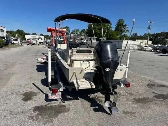 Slide: The Image of 1987 Boston Whaler 17 Montauk boat on trailer with outboard motor. - 5