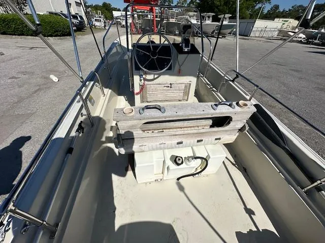 Slide: The Image of 1987 Boston Whaler 17 Montauk boat interior with steering console and seating. - 8
