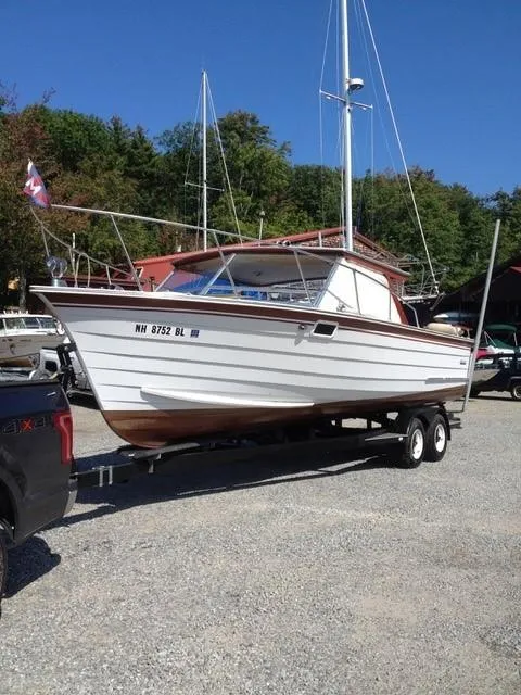 Slide: The Image of 1986 Skiff Craft Sport Fisherman 260 on a trailer in a boatyard. - 1