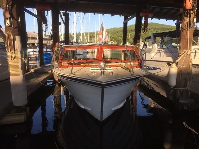 Slide: The Image of 1986 Skiff Craft Sport Fisherman 260 docked at a marina. - 11