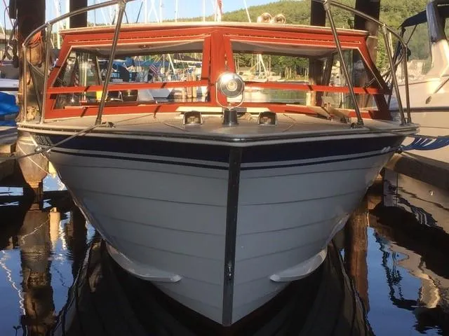 Slide: The Image of 1986 Skiff Craft Sport Fisherman 260 boat docked at a marina. - 12
