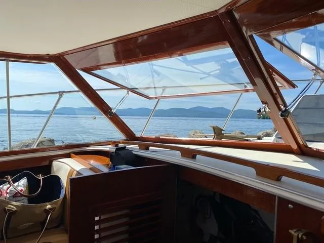 Slide: The Image of 1986 Skiff Craft Sport Fisherman 260 interior with scenic lake view. - 21