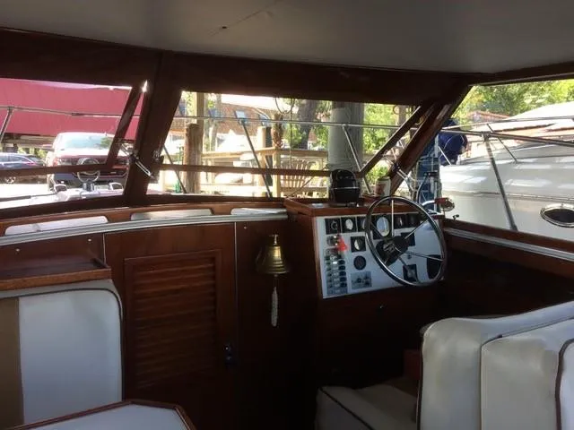 Slide: The Image of 1986 Skiff Craft Sport Fisherman 260 boat interior with steering wheel and control panel. - 7