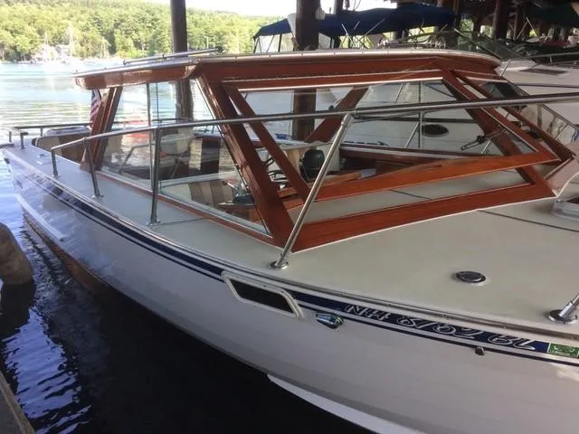 Slide: The Image of 1986 Skiff Craft Sport Fisherman 260 boat docked in a marina. - 8