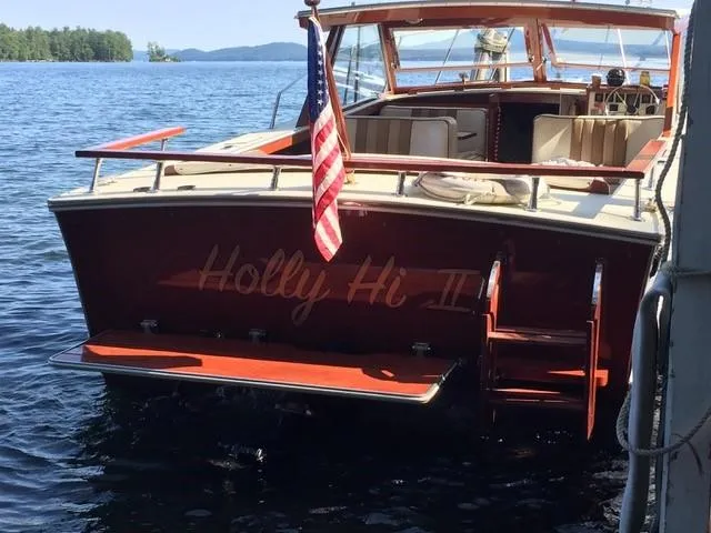 Slide: The Image of 1986 Skiff Craft Sport Fisherman 260 boat named Holly Hi II docked on a lake. - 9