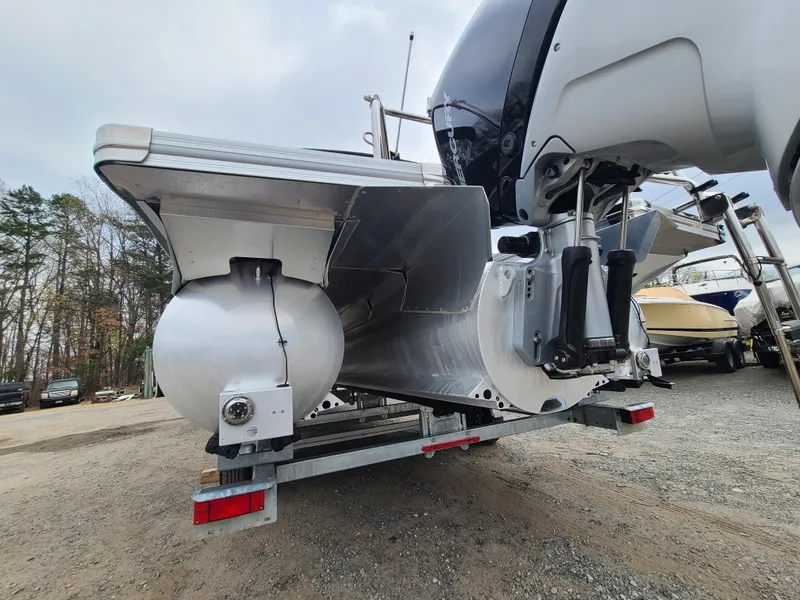 Slide: The Image of 2022 Barletta CORSA 25UC pontoon boat rear view on trailer. - 12