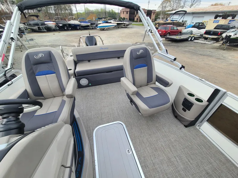 Slide: The Image of 2022 Barletta CORSA 25UC boat interior with seating and cup holders. - 16