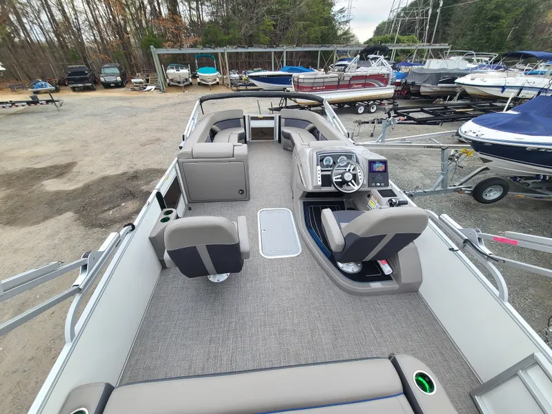 Slide: The Image of 2022 Barletta CORSA 25UC pontoon boat interior with helm and seating. - 17