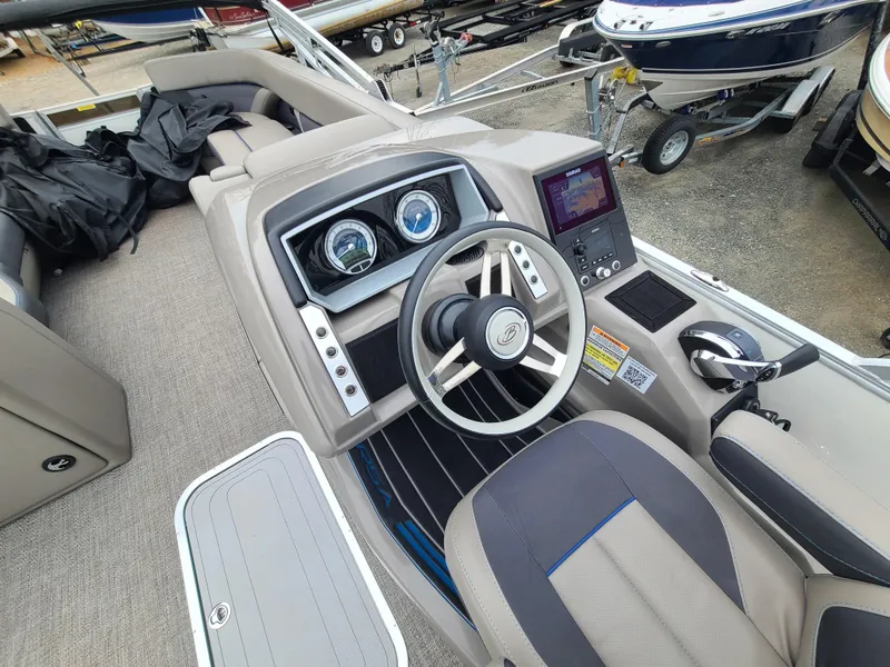 Slide: The Image of 2022 Barletta CORSA 25UC boat dashboard and steering wheel. - 20