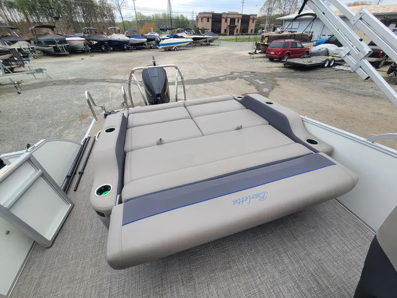 Slide: The Image of 2022 Barletta CORSA 25UC pontoon boat with spacious rear seating area. - 23